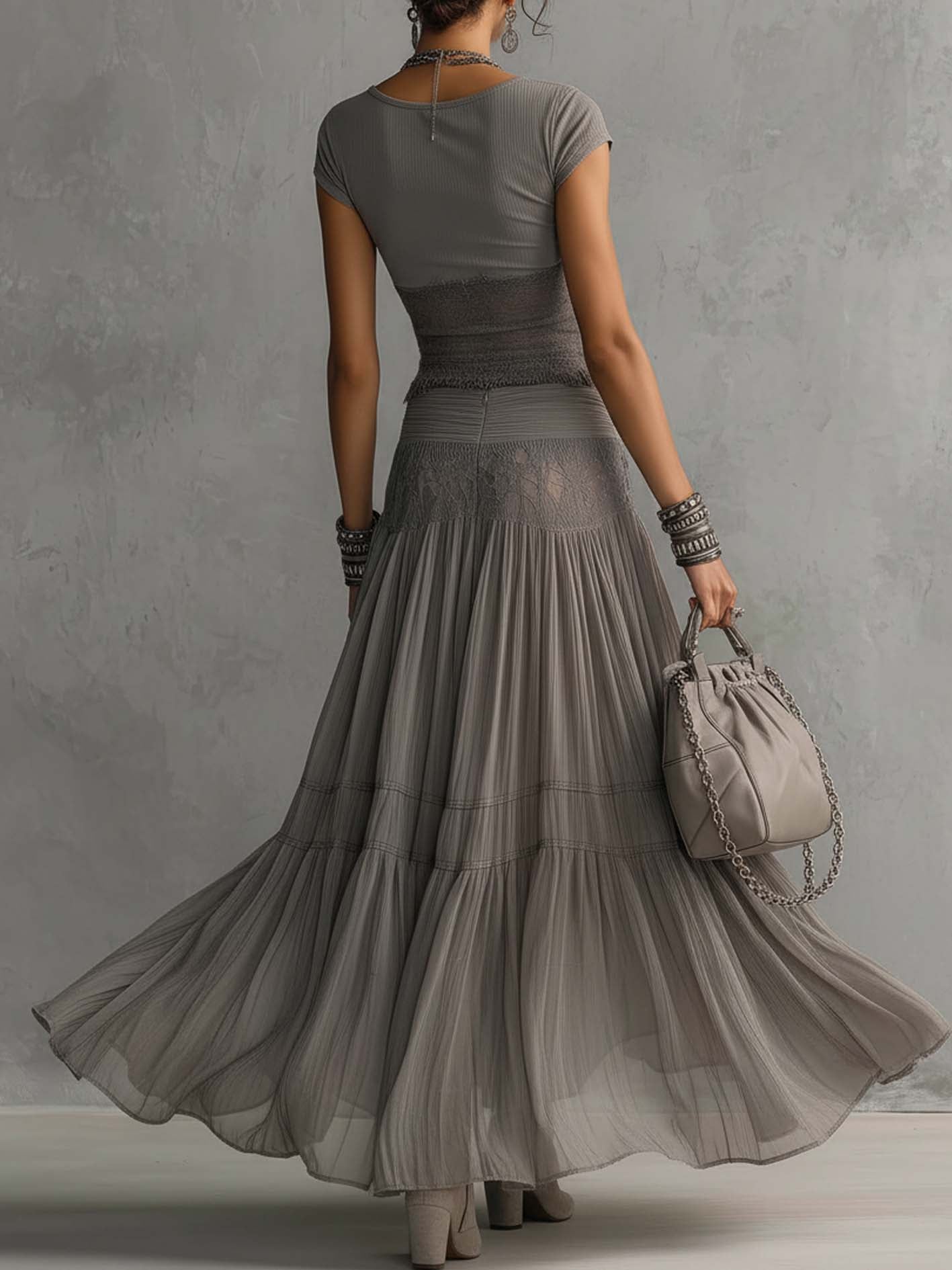 Geneva · Set consisting of a transparent top with black lace panels and a maxi pleated skirt