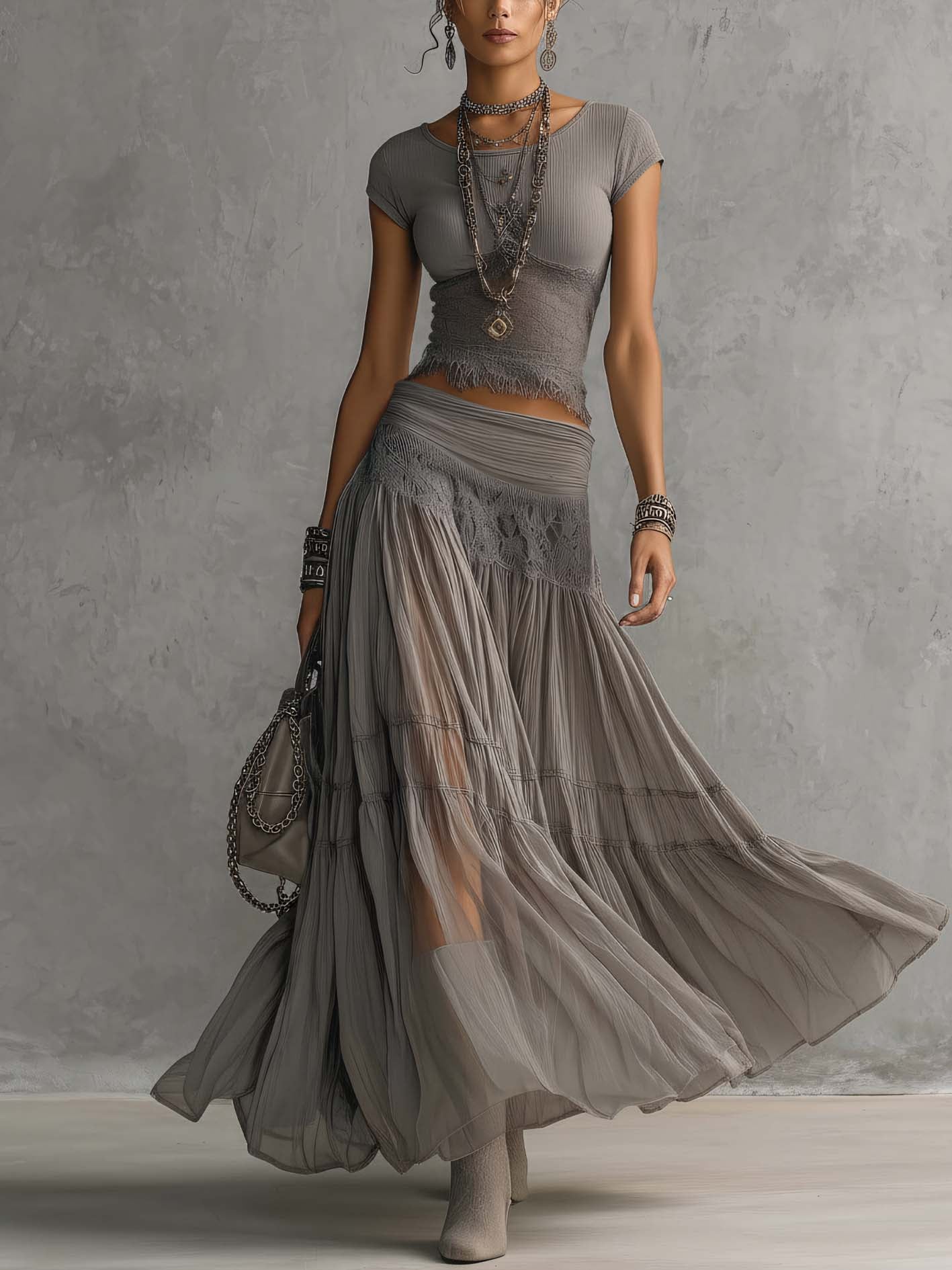 Geneva · Set consisting of a transparent top with black lace panels and a maxi pleated skirt