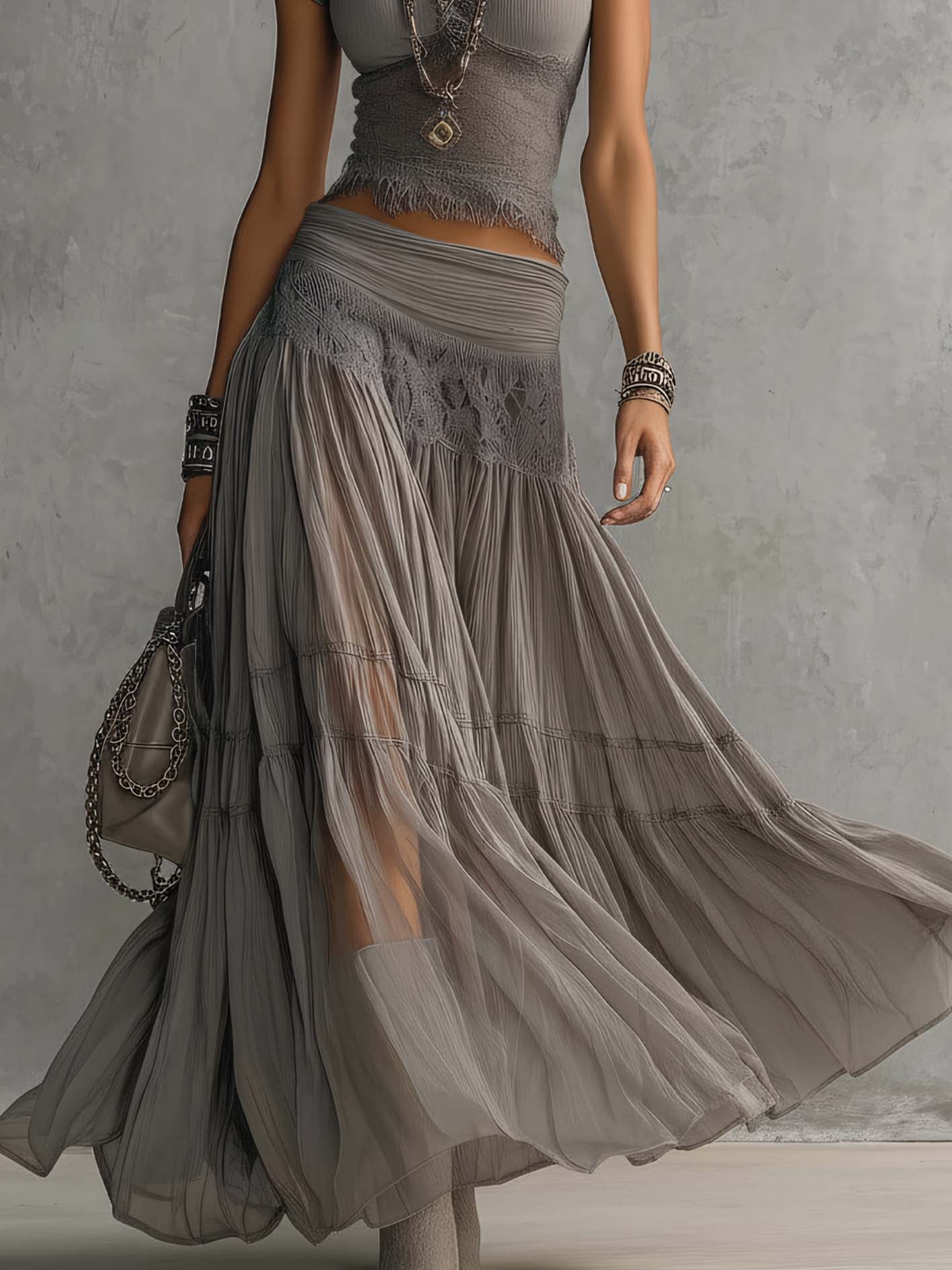 Geneva · Set consisting of a transparent top with black lace panels and a maxi pleated skirt